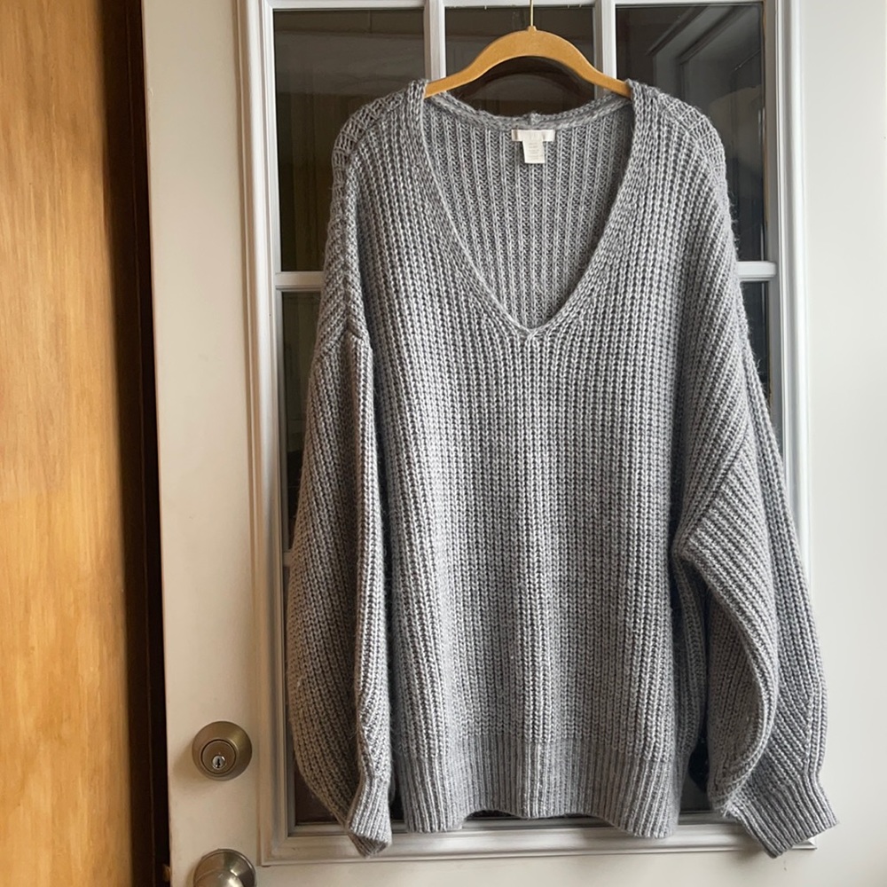 A cozy gray melange knit sweater.